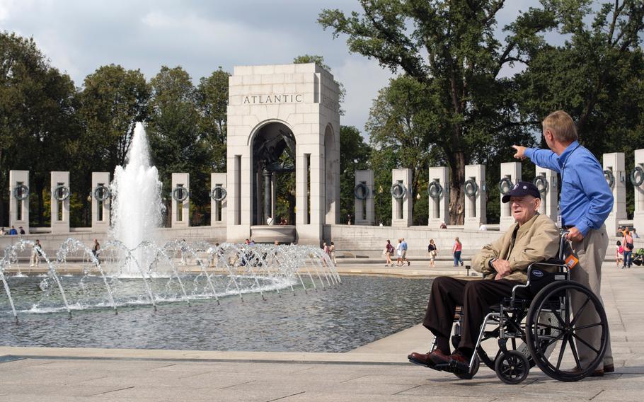 A member of an honor flight looks around the World War II Memorial on Oct. 1, 2014, in Washington, D.C.