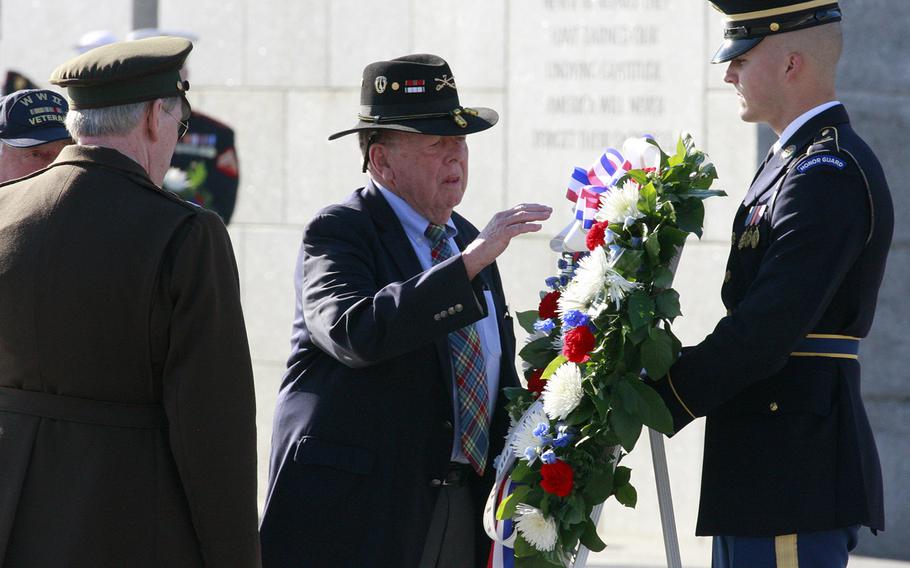 War correspondent Joseph L. Galloway lays a wreath on Veterans Day 2014 at the National World War II Memorial in Washington, D.C.