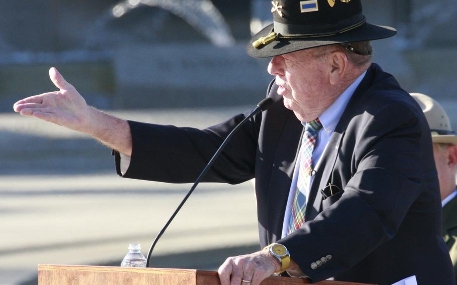 War correspondent Joseph L. Galloway hails World War II veterans in attendance during his keynote speech on Veterans Day 2014 at the National World War II Memorial in Washington, D.C.
