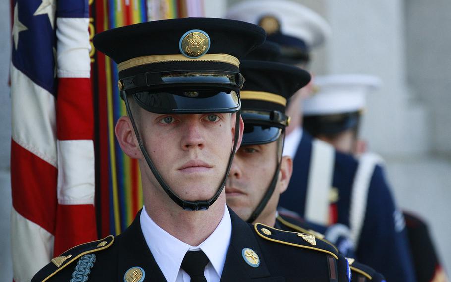 The Armed Forces Color Guard awaits the start of a Veterans Day ceremony at the National World War II Memorial in Washington, D.C., Nov. 11, 2014.