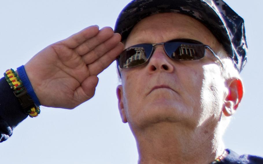 Vietnam veteran Jim Miller salutes during a Veterans Day 2014 ceremony at the U.S. Navy Memorial in Washington, D.C.