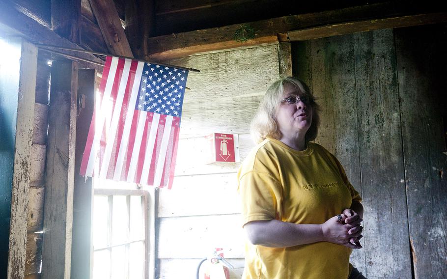 Kathy Dunlap, a resident and assistant house manager for the Guardian House, gives a tour of the homeless shelter at Ballston Spa, N.Y., on May 17, 2013. The Guardian House gives a place for up to 11 female veterans to live at a time.