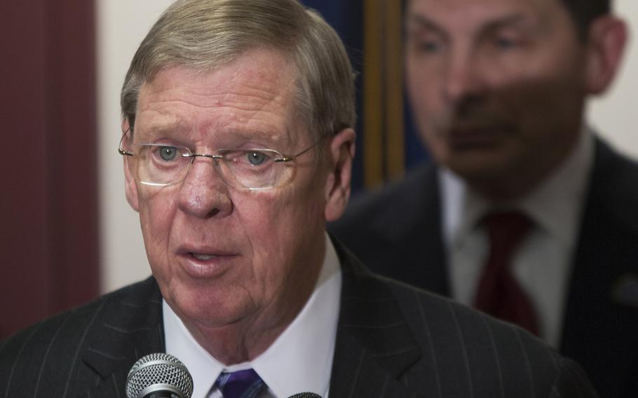 Sen. Johnny Isakson, R, Ga., chairman of the Senate Veterans Affairs Committee, speaks at a February, 2015 press conference. Behind him is VA Secretary Bob McDonald.