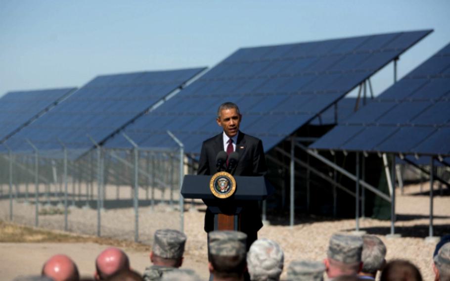 President Barack Obama delivers remarks on renewable energy, the economy and labor Thursday, April 3, 2015, in front of a solar array at Hill Air Force Base in Layton, Utah.