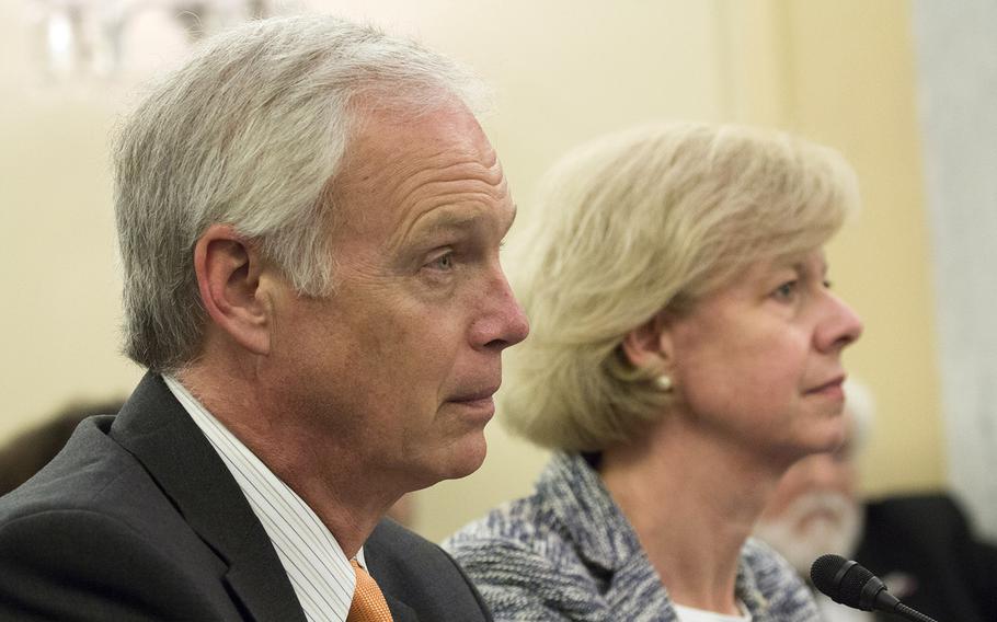 Sen. Ron Johnson, R-Wis. and Tammy Baldwin, D-Wis. listen during a discussion about the Jason Simcakoski Memorial Opioid Safety Act at a Senate Veterans Affairs Committee hearing, June 24, 2015