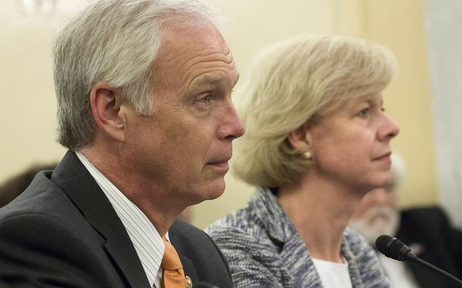 Sen. Ron Johnson, R-Wis. and Tammy Baldwin, D-Wis. listen during a discussion about the Jason Simcakoski Memorial Opioid Safety Act at a Senate Veterans Affairs Committee hearing, June 24, 2015