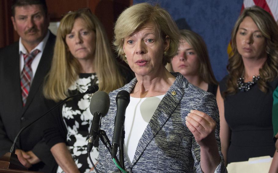 Sen. Tammy Baldwin, D-Wis., speaks at a press conference about the Jason Simcakoski Memorial Opioid Safety Act at the U.S. Capitol, June 24, 2015. Behind her are Jason Simcakoski's father, Marv; mother, Linda; daughter, Anaya; and widow, Heather.
