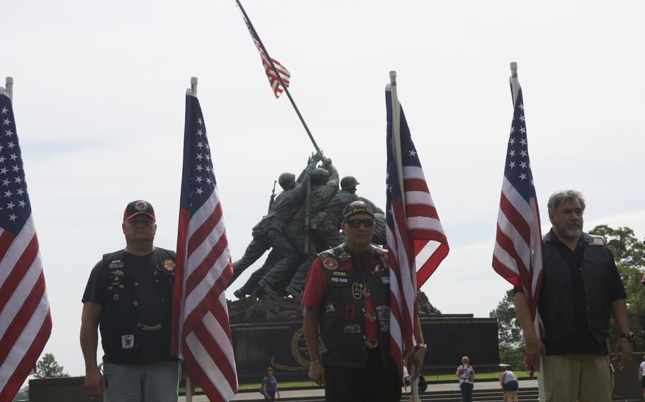 Members of the Patriot Guard stand at a ceremony Sunday in Arlington, Virginia  for former Marine Toran Gaal, a double amputee, who handcycled across the country to raise money for the Semper Fi Fund.