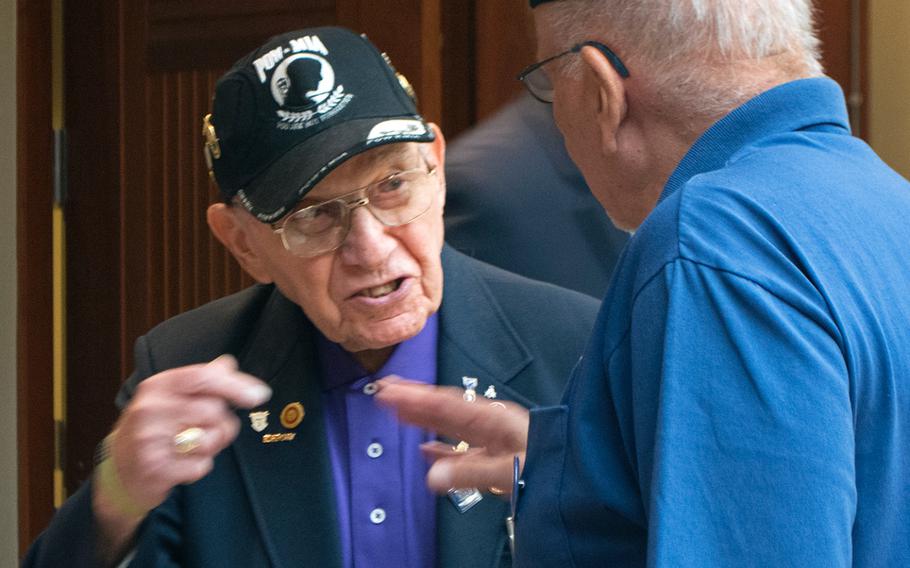 Jerry Wolf, left, speaks with Richard Rinaldo, both Purple Heart recipients, before the start of the Purple Heart ceremony at Mount Vernon on Aug. 7, 2015, about his time as a prisoner of war in a German camp during World War II. 