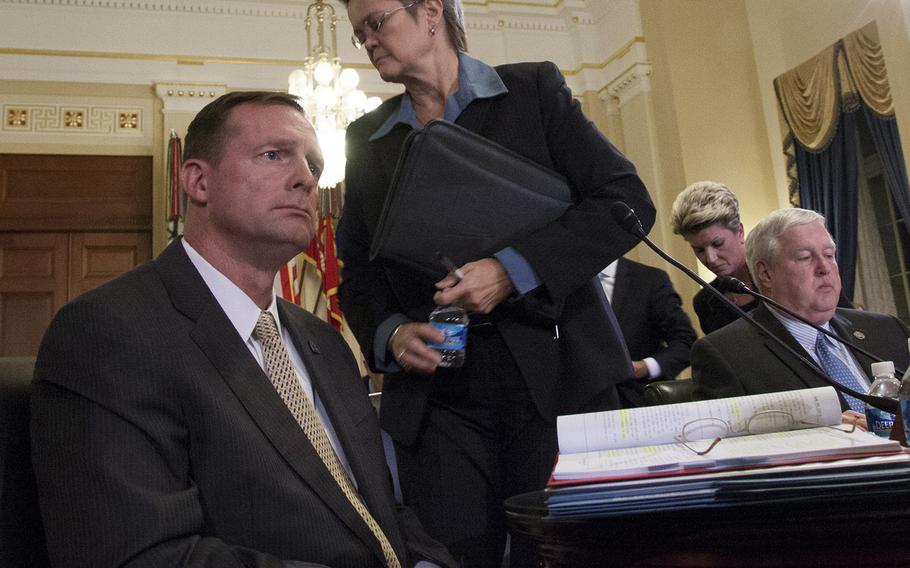 Diana Rubens, director of the VA's Philadelphia and Wilmington regional offices, prepares to leave a House Veterans Affairs Committee hearing on alleged misuse of the VA relocation program, Nov. 2, 2015, on Capitol Hill. Rubens and St. Paul regional office Director Kimberly Graves, background, were excused by Chairman Rep. Jeff Miller, R-Fla., after they declined to answer questions. At left is Robert McKenrick of VA's Los Angeles regional office; at right is Danny Pummill, principal deputy under secretary for benefits of the Veterans Benefits Administration.