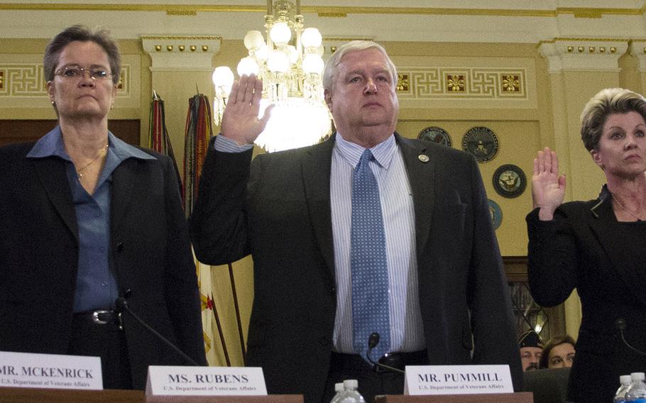 Left to right, Diana Rubens of the VA Philadelphia and Wilmington regional offices, Danny Pummill, principal deputy under secretary for benefits of the Veterans Benefits Administration, and Kimberly Graves of the VA's St. Paul regional office are sworn in at the start of a House Veterans Affairs Committee hearing on alleged misuse of the VA relocation program, Nov. 2, 2015, on Capitol Hill.