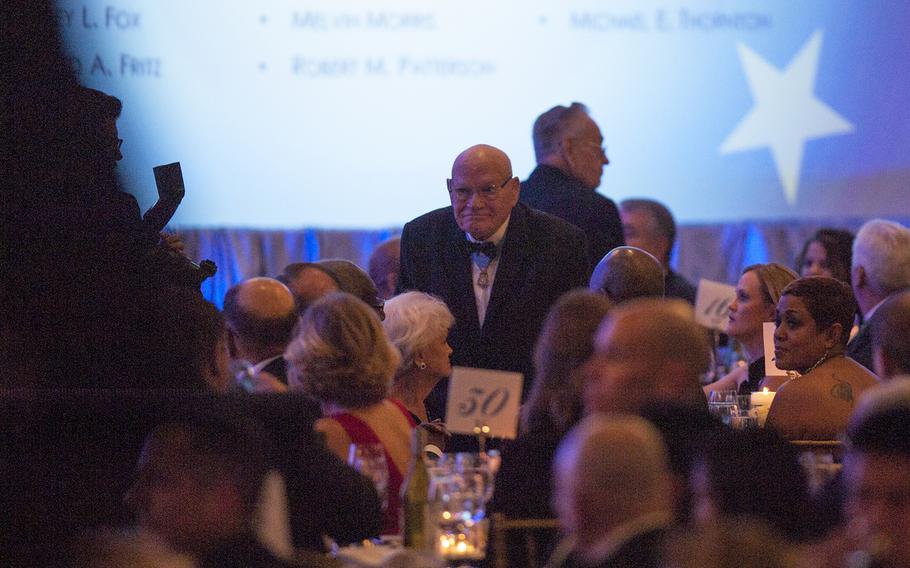 Medal of Honor recipient Bennie Adkins, a retired Army soldier, stands as his name is read out loud during the  Veterans Inaugural Ball: Salute to Heroes in Washington, D.C., Jan. 20, 2017.