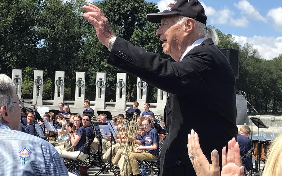 Herman Zeitchik waves to the crowd gathered for the 73rd D-Day commemoration at the World War II Memorial on June 6, 2017. Zeitchik served with the 4th Infantry Division Field Artillery and took part in the Nromandy Invasion on June 6, 1944. He was part of the first wave, landing on Utah Beach at H-Hour. He also took part inthe Liberation of Paris and the liberation of Dachau Concentration Camp. 