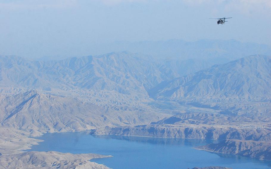 UH-60L Black Hawk helicopter crewed by members of the Massachusetts National Guard flies over eastern Afghanistan on Oct. 11, 2013.