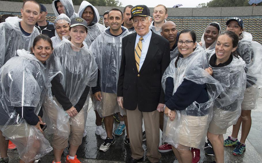 Hall of Fame NFL Coach Marv Levy poses with sailors from Naval Support Activity Hampton Roads after a ceremony marking the 72nd anniversary of V-J Day, September 2, 2017 at the National World War II Memorial in Washington, D.C. Levy was the keynote speaker.