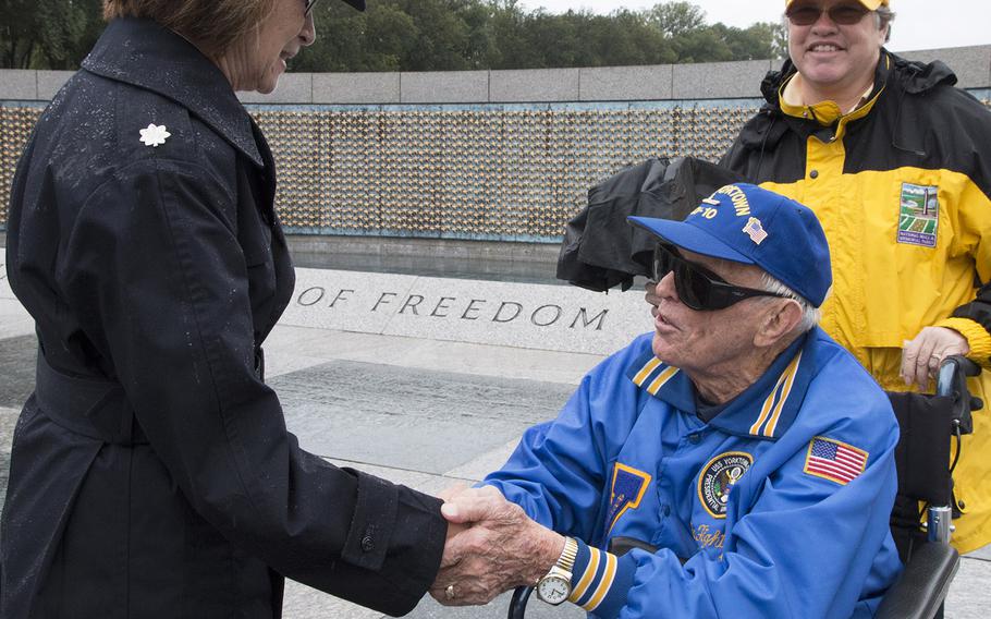 Chaplain Lt. Col. Tammie Crews talks with World War II veteran Andrew Abugelis after a ceremony marking the 72nd anniversary of V-J Day, September 2, 2017 at the National World War II Memorial in Washington, D.C.