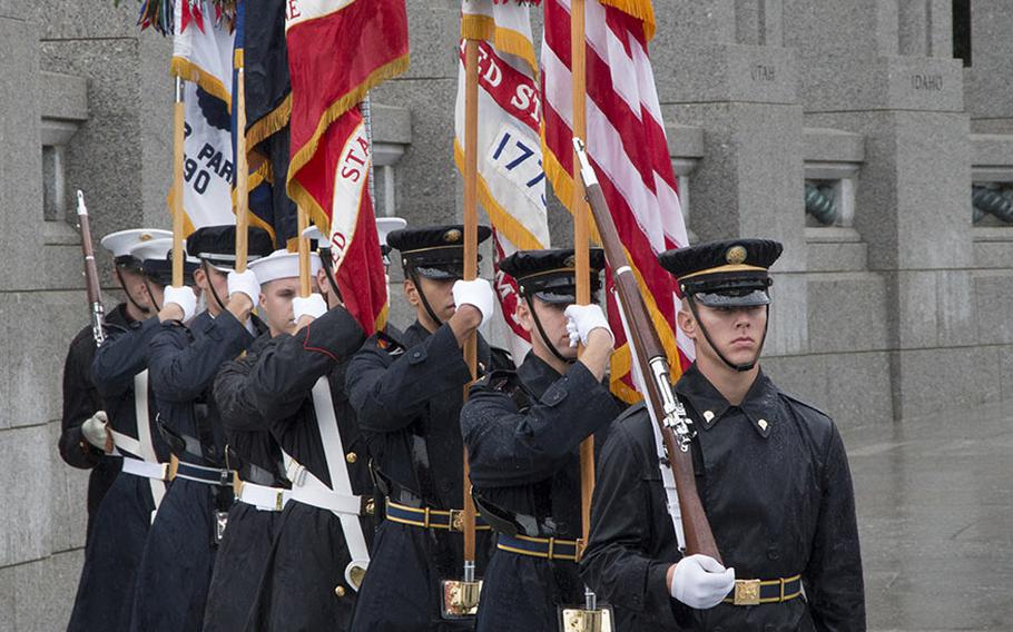Members of the U.S. Armed Forces Color Guard present the colors at a ceremony marking the 72nd anniversary of V-J Day, September 2, 2017 at the National World War II Memorial in Washington, D.C.