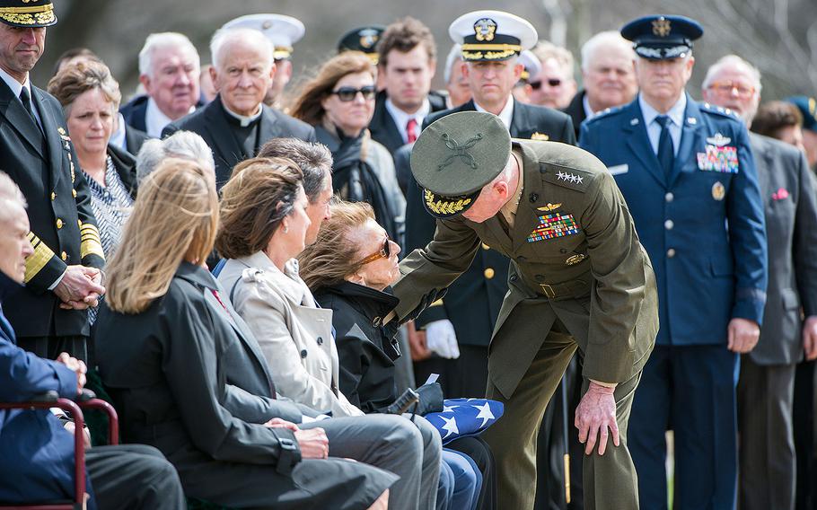 U.S. Marine Corps Gen. Joseph Dunford, chairman of the Joint Chiefs of Staff, offers his condolences to Georgea Hudner during her husband's funeral. On Wednesday, April 4, 2018, U.S. Navy Capt. Thomas J. Hudner was buried at Arlington National Cemetery in Virginia.