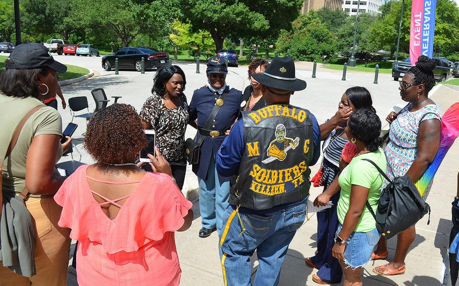 Women line up for photos with Rosieleeta Reed following Texas’s first Women Veterans Day celebration held on the steps of the Texas State Capitol on June 12, 2018. Reed presents a living history exhibition of the only female Buffalo Soldier, Cathay Williams.