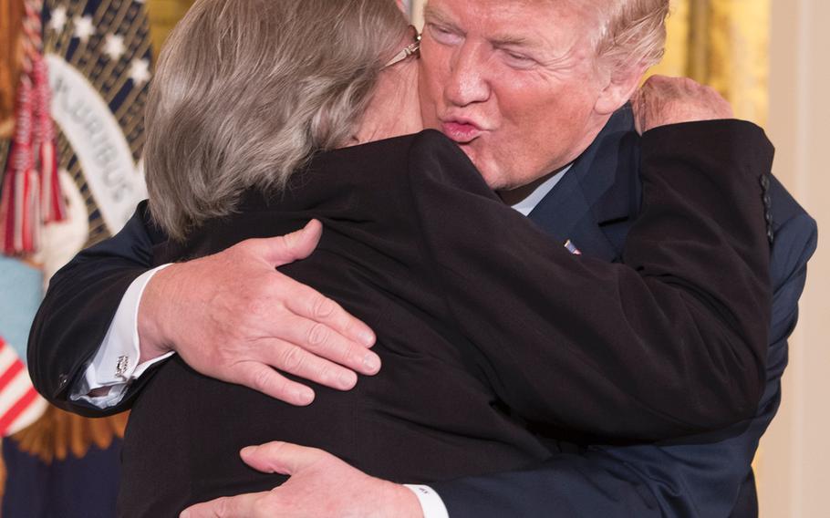 President Donald Trump awarded the nation’s highest military decoration to Garlin “Murl” Conner’s widow, Pauline, in a White House ceremony June 26, 2018. In this photo, Pauline kissed President Trump's cheek.