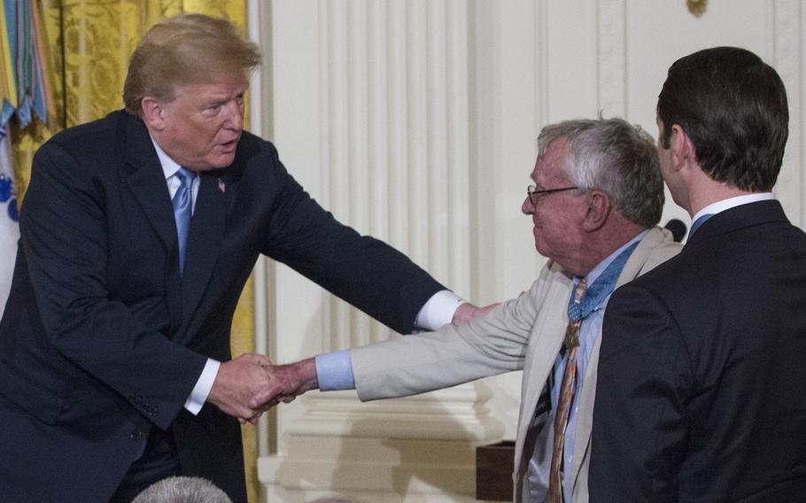 President Trump shakes hands with retired Navy Captain Thomas Kelley, a 1970 Medal of Honor recipient, after welcoming him to a Medal of Honor presentation for Garlin "Murl" Conner on June 26, 2018. 