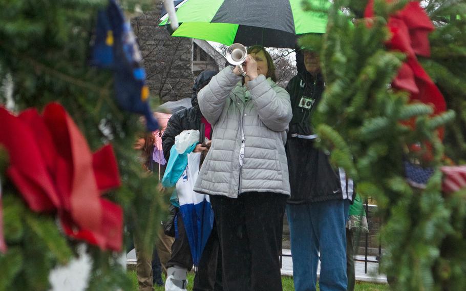 A bugler plays TAPS during a ceremony at the start of Wreaths Across America at The US Soldiers' and Airmen's Home National Cemetery on Dec. 15, 2018, in Washington, D.C. 