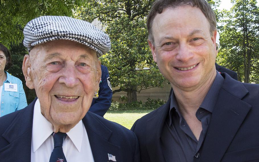 World War II veteran Richard Cole, one of the famed World War II Doolittle Raiders, stands beside Actor Gary Sinise before the National Memorial Day Parade in Washington, D.C. in May, 2014. Cole, the last of the 80 Doolittle Tokyo Raiders, died Tuesday, April 9, 2018. He was 103.