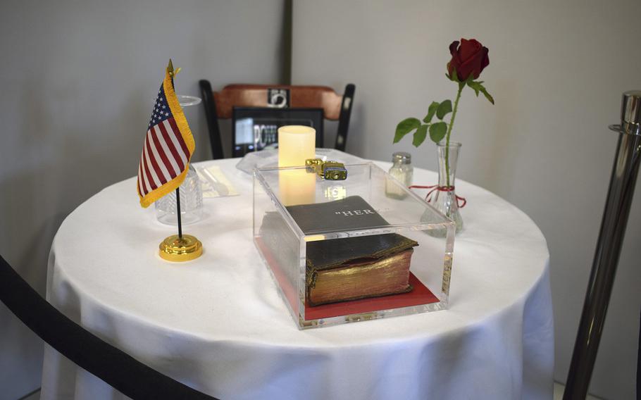 A Bible is part of a memorial table display at the veterans hospital in Manchester, N.H.