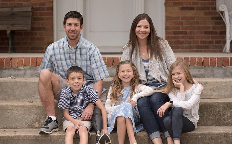 Retired Army Capt. Ryan Kules with his wife Nancy and their children Jillian, Liv and Evan. Injured by a roadside bomb in 2005, Kules lost his right arm above the elbow and his left leg above the knee. He now works with Wounded Warrior Project and helped push for new legislation to get more government funding for disabled veterans to modify their homes.