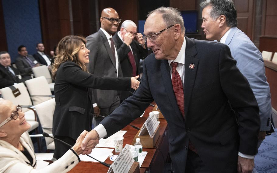 House Veterans' Affairs Committee Ranking Member Phil Roe, R-Tenn., shakes hands with Dr. Teresa S. Boyd, Veterans Health Administration assistant deputy under secretary for health for clinical operations, before a House Veterans' Affairs Committee hearing on the situation with wait times at VA hospitals, five years after the Phoenix scandal, July 24, 2019 on Capitol Hill. Behind him, committee Chairman Mark Takano, D-Calif., greets Dr. Susan R. Kirsh, Veterans Health Administration acting assistant deputy under secretary for health for access to care.