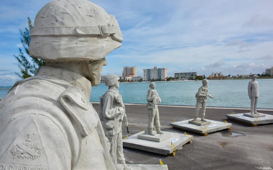 Some of the Circle of Heroes Veterans Memorial statues, before they were lowered into the Gulf of Mexico.