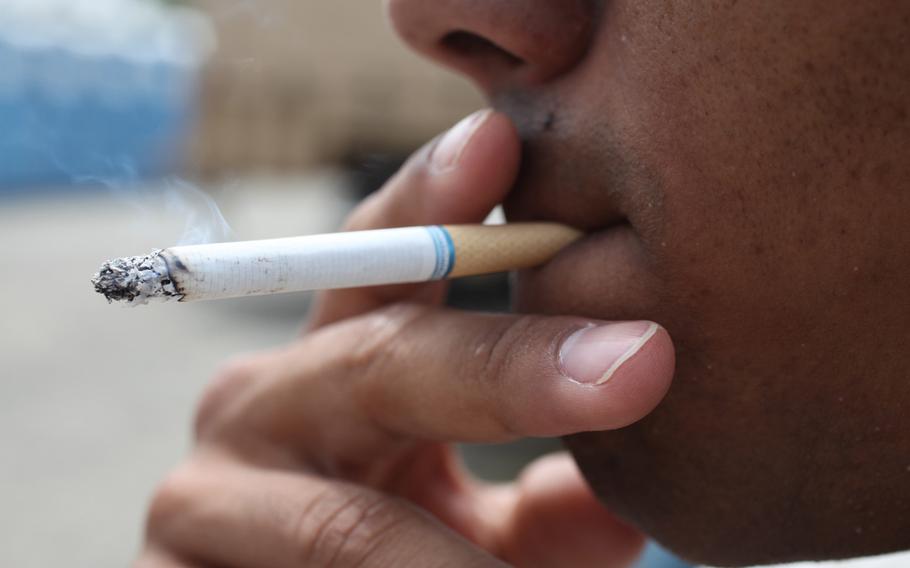 A Marine at Camp Pendleton, Calif., is shown smoking a cigarette in June 24, 2011. A recently announced ban on smoking at Department of Veterans Affairs health care facilities will also now apply to employees, VA officials said.