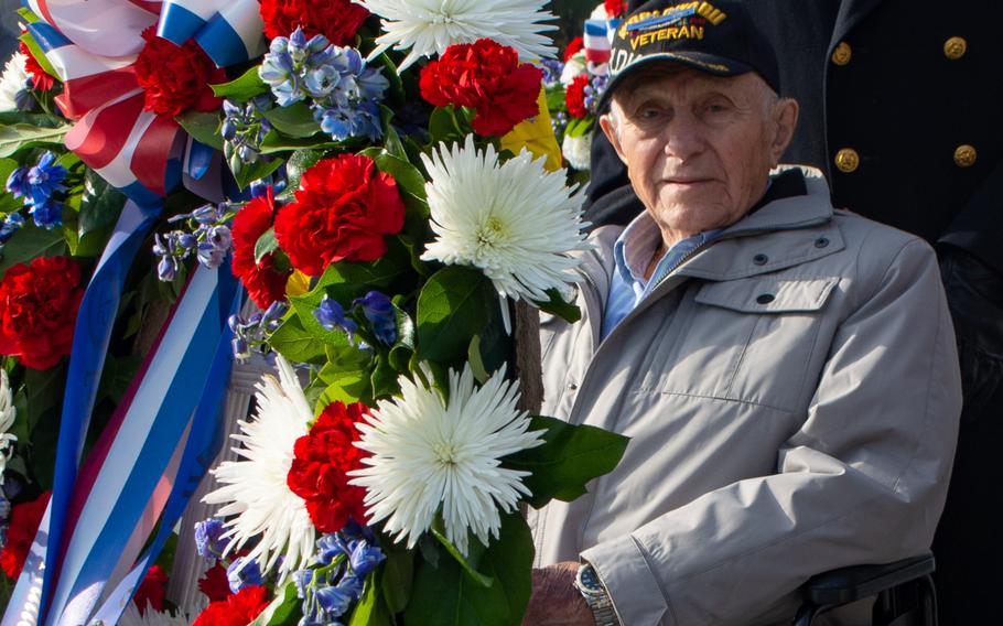 Veterans Day at the World War II Memorial involved a wreath-laying ceremony and a Parade of Heroes. During the Parade of Heroes, a World War II veteran was called and his military history read aloud. 