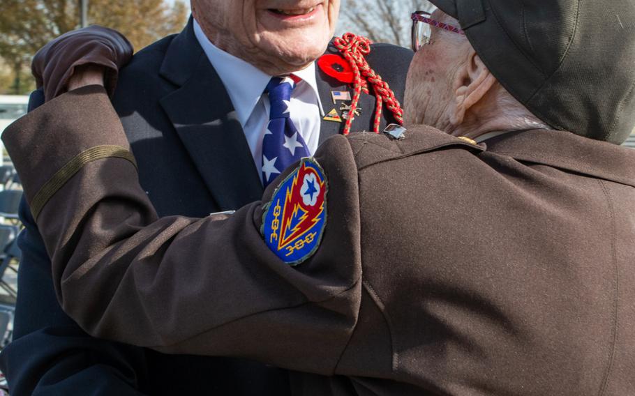 WWII nurse Elizabeth Lewis and new friend WWII veteran Harry Miller share a hug following the Veterans Day ceremony at the World War II Memorial. Veterans Day at the WWII Memorial involved a wreath-laying ceremony and a Parade of Heroes. During the Parade of Heroes, a World War II veteran was called and his military history read aloud. 