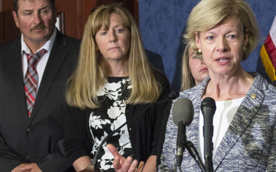 In a 2015 photo, Sen. Tammy Baldwin, D-Wis., speaks about the Jason Simcakoski Memorial Opioid Safety Act at an awareness event in Washington, D.C. Behind her at left are Marv and Linda Simcakoski, parents of Marine Cpl. Jason Simcakoski, who suffered a fatal overdose while an inpatient at the Tomah Veterans Affairs Medical Center in August 2014.