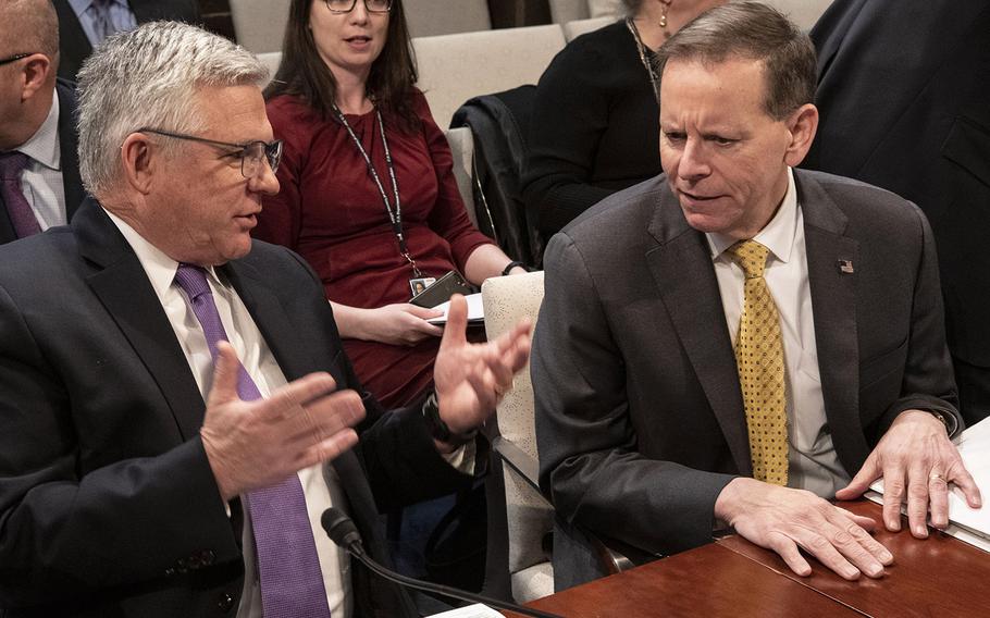 Veterans Health Administration Executive in Charge Dr. Richard Stone, left, talks with VA Under Secretary for Benefits Dr. Paul Lawrence before a House Veterans' Affairs Committee hearing on Capitol Hill, Feb. 27, 2020.