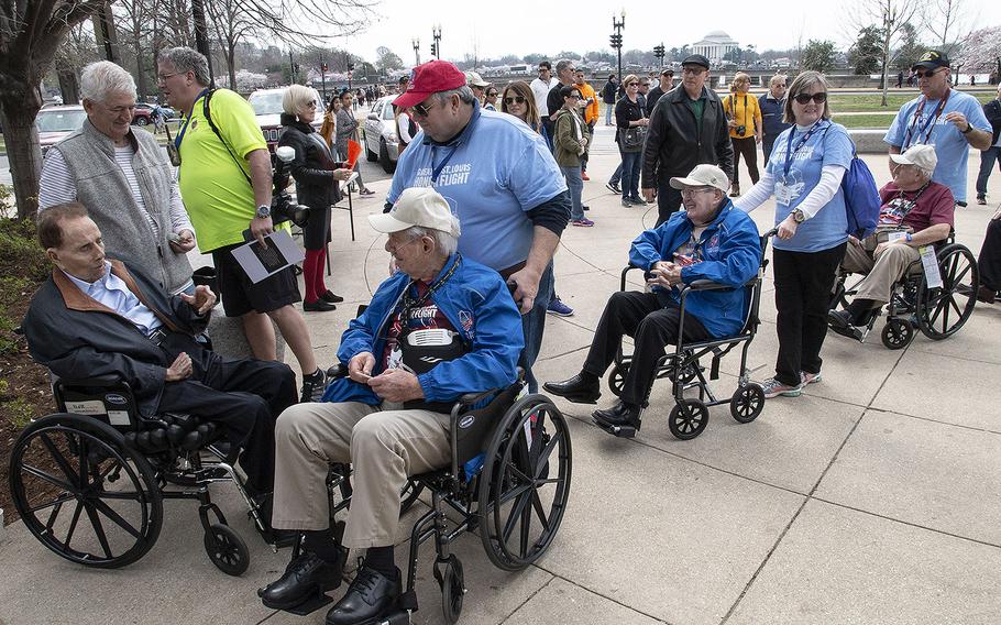 Former Sen. Bob Dole greets fellow veterans who were visiting the National World War II Memorial in Washington, D.C. on an Honor Flight in March 2019.