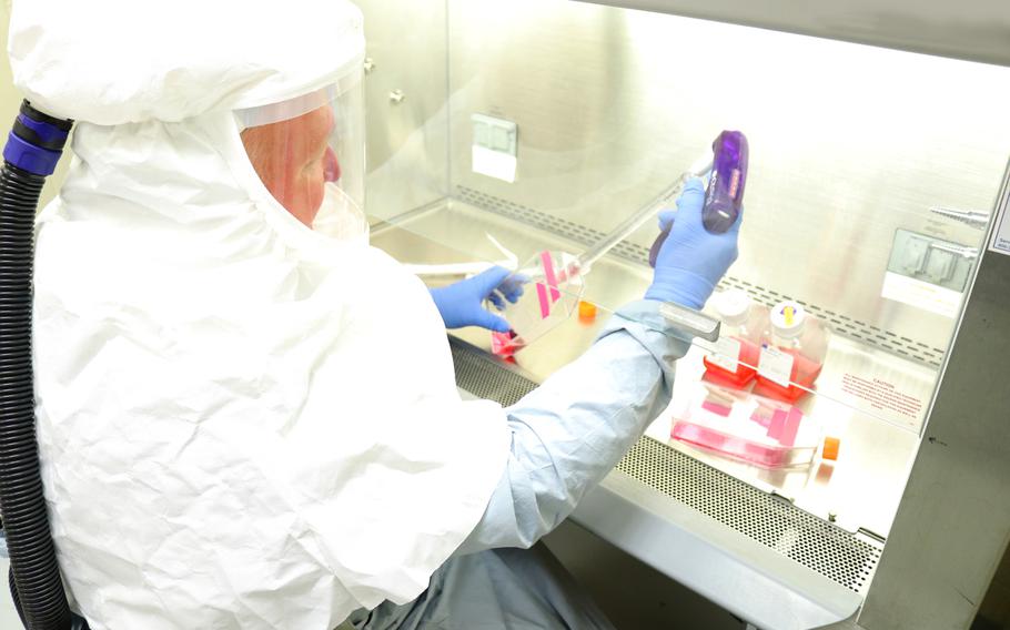 Brian Kearney, Research Microbiologist, harvests samples of coronavirus in a Biosafety Level 3 laboratory at the U.S. Army Medical Research Institute of Infectious Diseases at Fort Detrick, Md., on March 3, 2020.