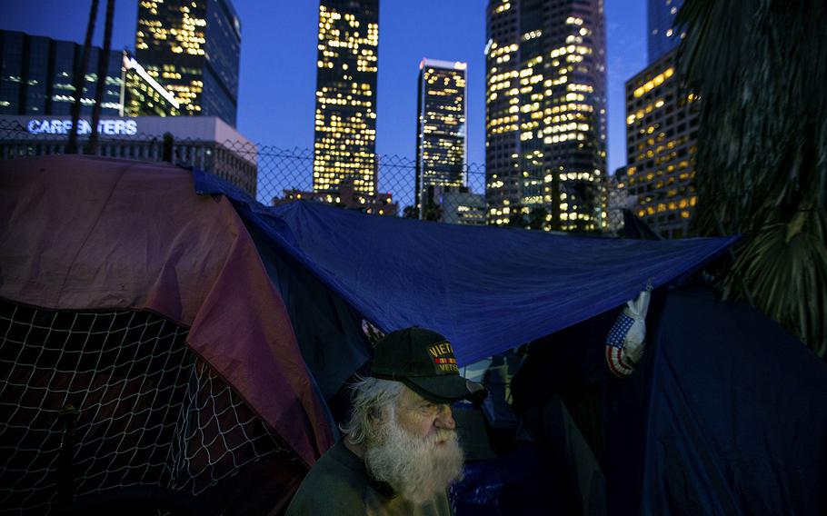 In a 2017 photo, a Vietnam War veteran is shown in his tent on South Beaudry Avenue in Los Angeles.