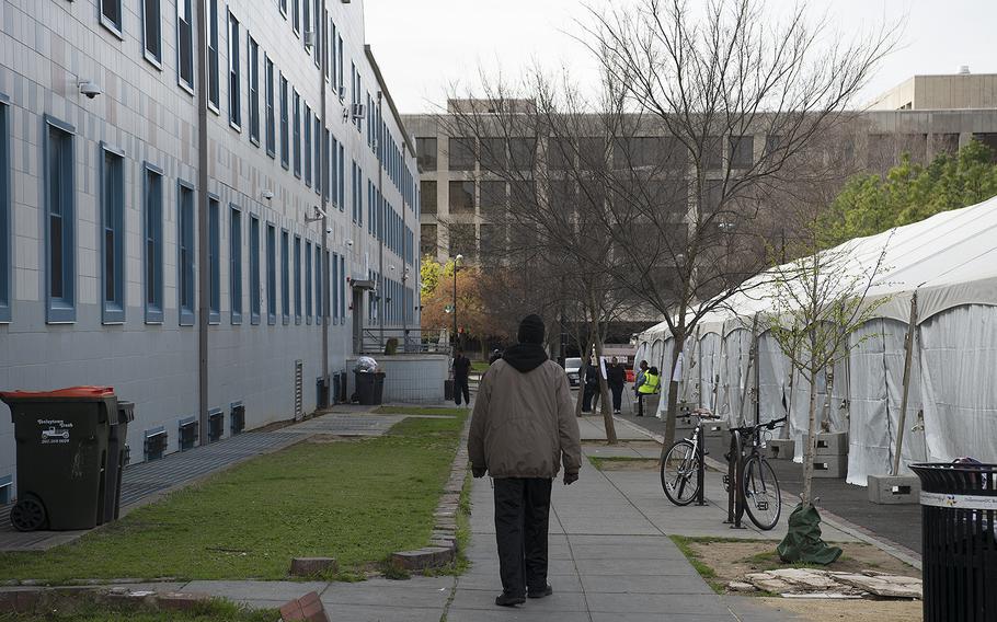 A holding tent stands outside the main homeless shelter in Washington, D.C., on Saturday, March 4, 2020. The shelter and tent are not far from a U.S. Army Corps of Engineers emergency operations vehicle, parked about four blocks away.