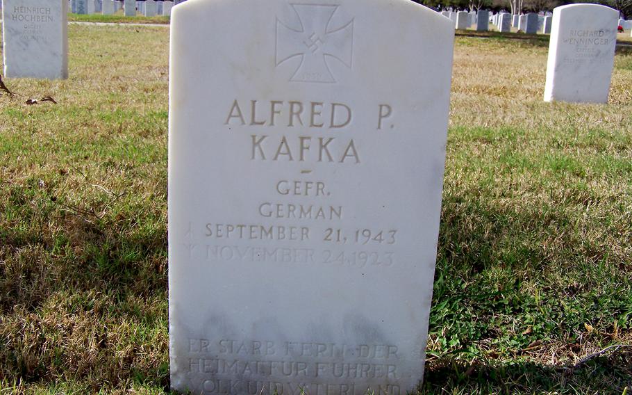 Headstone of a fallen German WWII POW. Note the inscription on the bottom and that the soldier was a knights cross winner. 