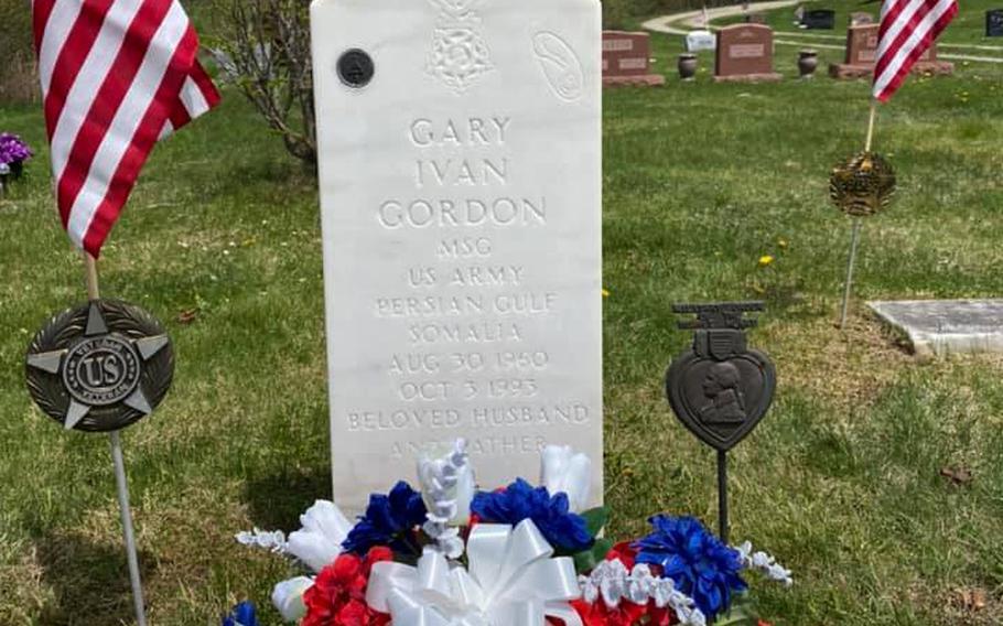 A photo shows Medal of Honor recipient Master Sgt. Gary Gordon’s headstone in a cemetery in Lincoln, Maine, after a cleaning by Maine Gravesite Maintenance on Thursday, May 21, 2020, to remove paint that had been sprayed on in what police said was an apparent act of vandalism.