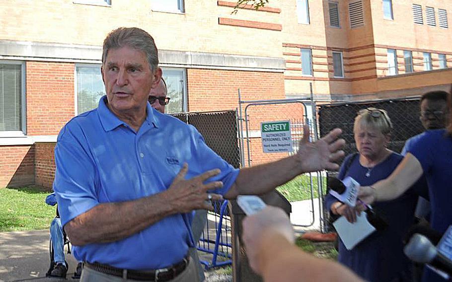 Sen. Joe Manchin answers questions outside of the Louis A. Johnson VA Medical Center in Clarksburg, W.Va. Manchin had called for an expedited investigation into the suspicious deaths at the hospital. Court documents unsealed Tuesday, July 14, 2020, show Reta Mays, a former nursing assistant at the  facility is being charged with second degree murder in the deaths of seven people.