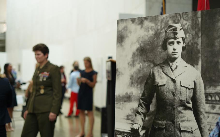 A portrait a female Marine is displayed at the exhibition Women Marines — Proudly Serving 1918-2018 at the Women in Military Service for America Memorial in Arlington, Va., on Aug. 12, 2018.