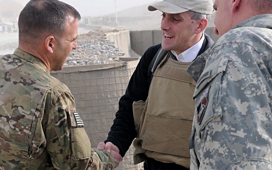 In a December, 2010 photo, U.S. Army Col. Bruce P. Antonia, left, commander of 4th Brigade Combat Team, 10th Mountain Division's Task Force Patriot, greets then-U.S. Deputy National Security Advisor Denis McDonough at the Patriot helipad on Forward Operating Base Shank, Afghanistan.