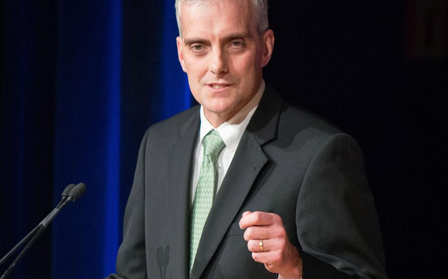 In a Dec. 2, 2013 photo, White House Chief of Staff Denis McDonough delivers remarks at a farewell ceremony for outgoing Deputy Defense Secretary Ash Carter at the Pentagon.