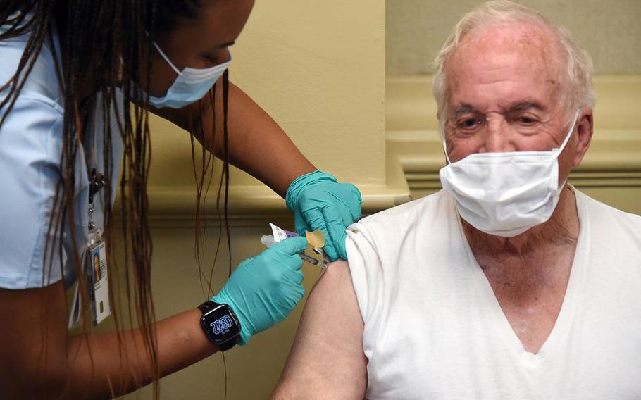 Korean War veteran Norman Hale, 90 of Vinemont gets his coronavirus vaccine shot from RN Precious Reynolds at the Birmingham VA Medical Center, December 17, 2020.