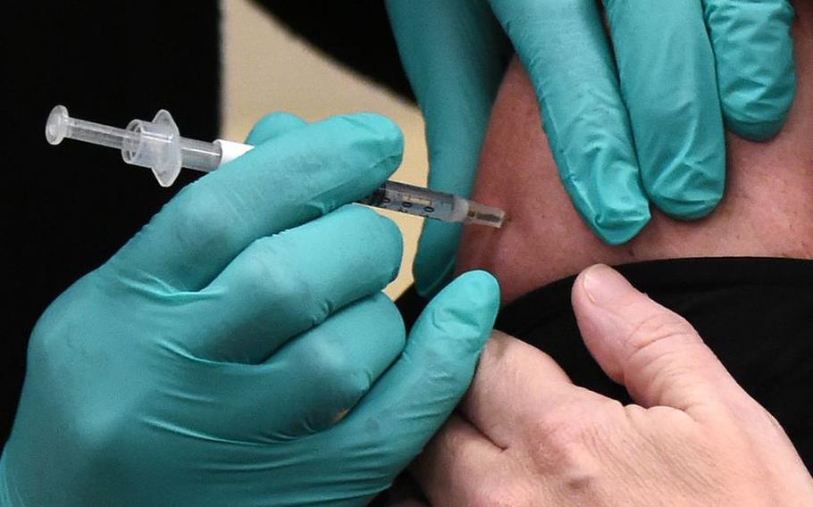 A coronavirus vaccination shot is administered at the Birmingham, Ala., VA facility.