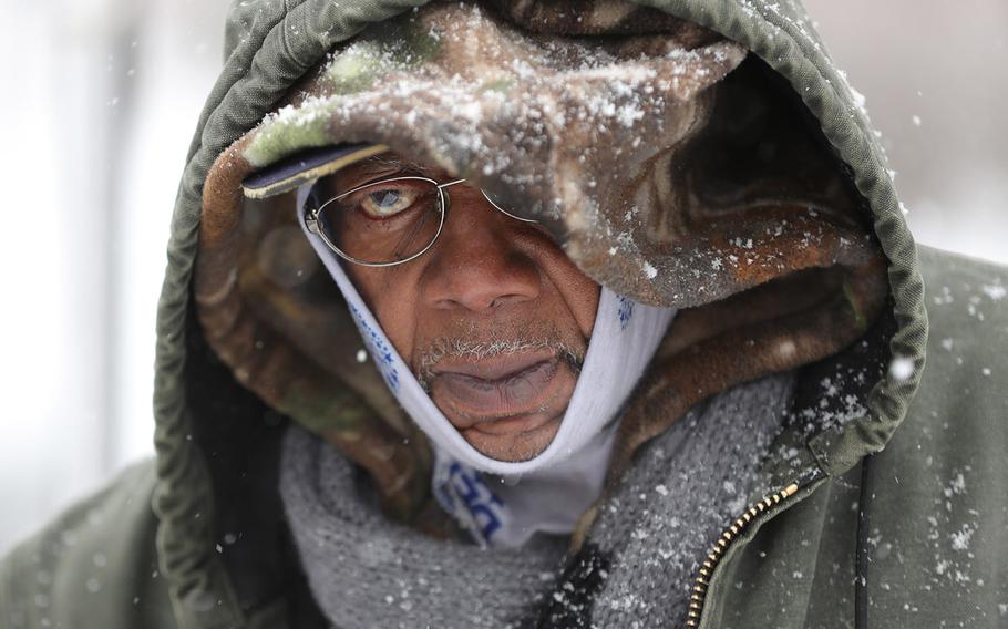 In a February 26, 2020 photo, homeless Army veteran Bobbie King makes his way to his volunteer position at the Nova Project in Detroit.
