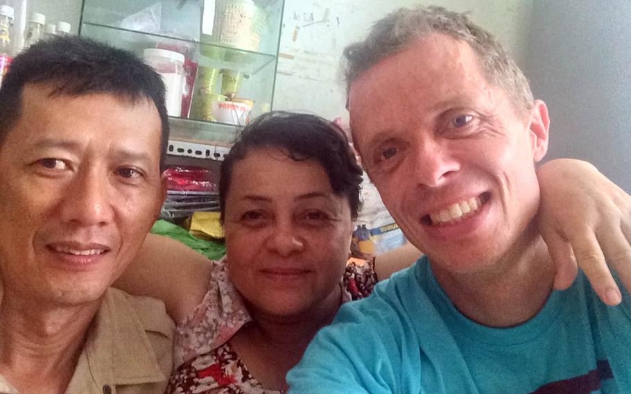 Brian Hjort poses with friends in Ho Chi Minh City, Vietnam, in 2016. The antique furniture repairman from Copenhagen, Denmark, helps Amerasians in Vietnam and the Philippines find their American GI fathers.